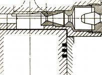 Schematický výkres dvojité komůrky v hlavě válců systému Lanova, kde je vidět umístění vstřikovací trysky přesně proti otvoru výstupního kanálku komůrky.
